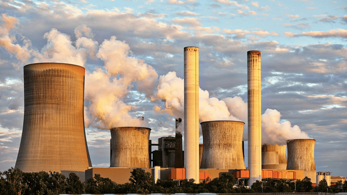 factories blowing smoke in the air and causing climate pollution