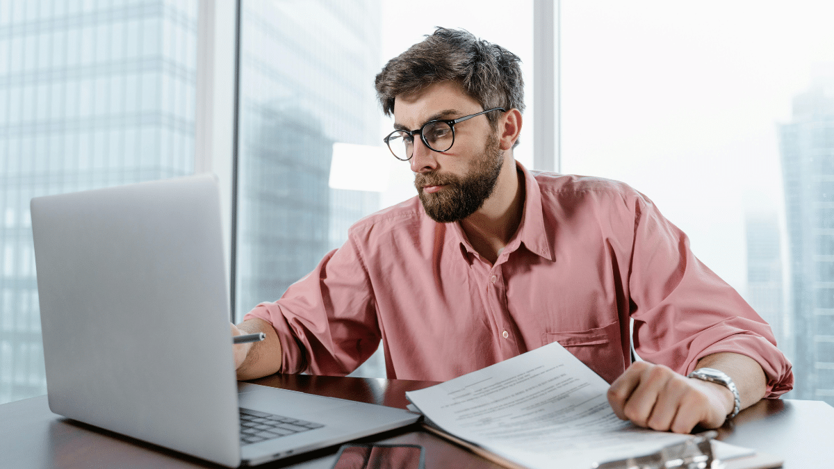 A public sector worker reviewing data on his device